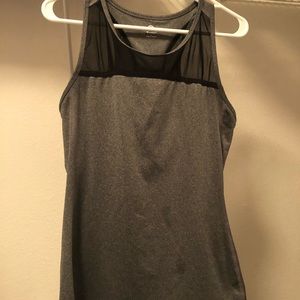 Work out top with mesh accent on chest. Size L